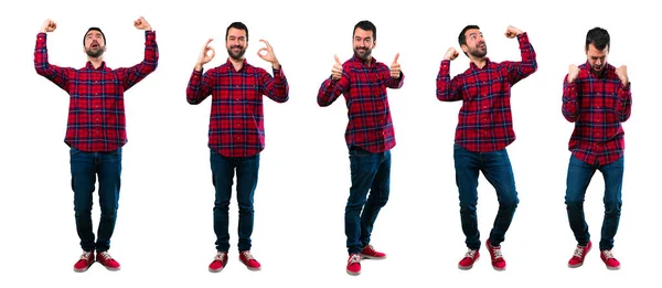 Conjunto de hombre guapo sonriendo y mostrando señal de victoria —  Fotos de Stock