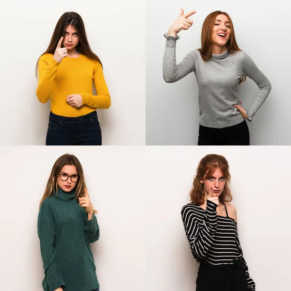 Set of women over white background frustrated by a bad situation and pointing to the front