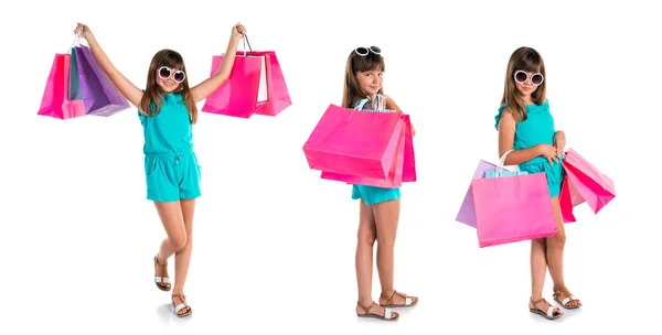 小可爱的女孩与许多购物袋 — 图库照片