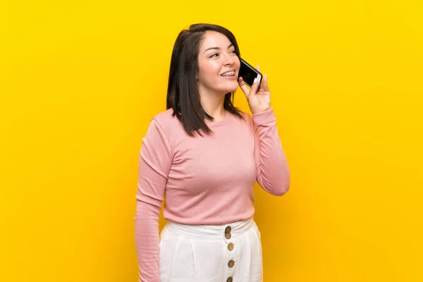 Young Mexican Woman Isolated Yellow Background Keeping Conversation Mobile Phone — Stock Photo, Image