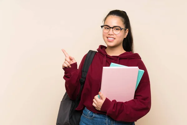 Joven Estudiante Asiática Chica Mujer Sobre Aislado Fondo Apuntando Dedo — Foto de Stock
