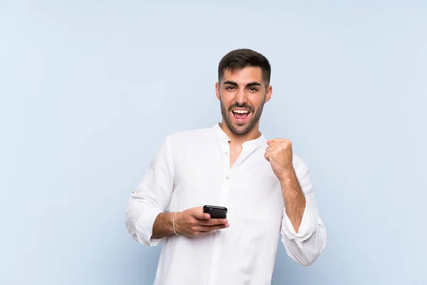 Bel Homme Avec Barbe Sur Fond Bleu Isolé Avec Téléphone — Photo