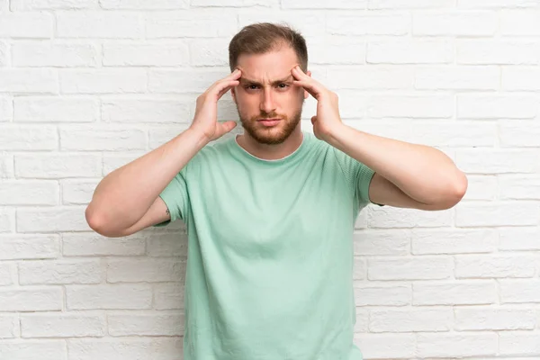 Blonde Man Brick Wall Unhappy Frustrated Something Negative Facial Expression — Stock Photo, Image