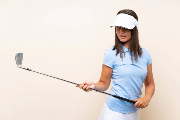 Young golfer woman over isolated background — Stock Photo, Image