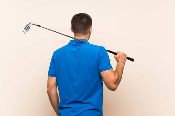 Jovem bonito golfista homem sobre isolado fundo — Fotografia de Stock