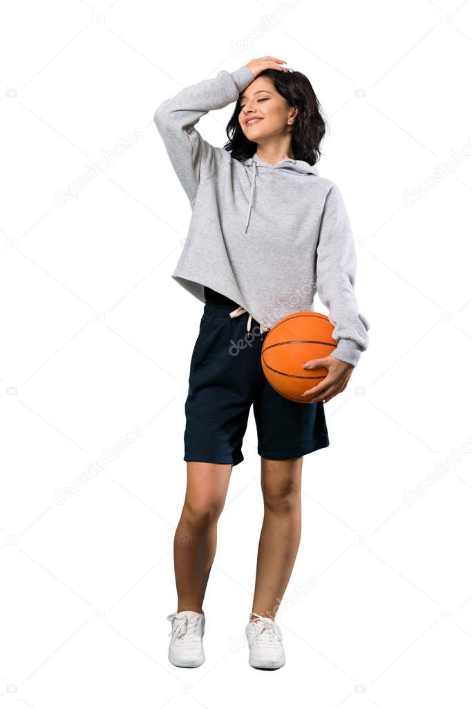 A full-length shot of a Young woman playing basketball has realized something and intending the solution over isolated white background