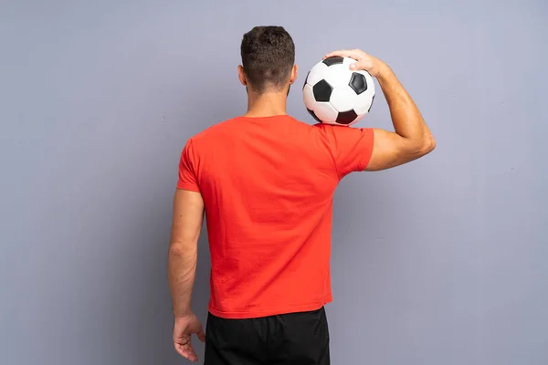 Knappe jonge voetballer man — Stockfoto