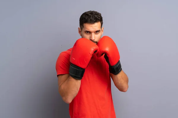 Joven deportista con guantes de boxeo —  Fotos de Stock