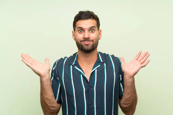 Bonito Homem Sobre Fundo Isolado Com Dúvidas Com Expressão Facial — Fotografia de Stock