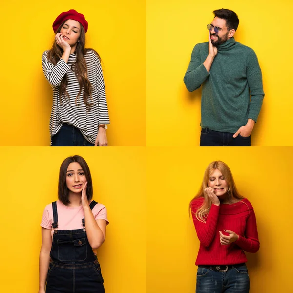 Diş ağrısı olan bir grup insan.