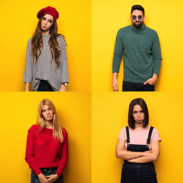 Üzgün ve depresif ifadeli bir grup insan.