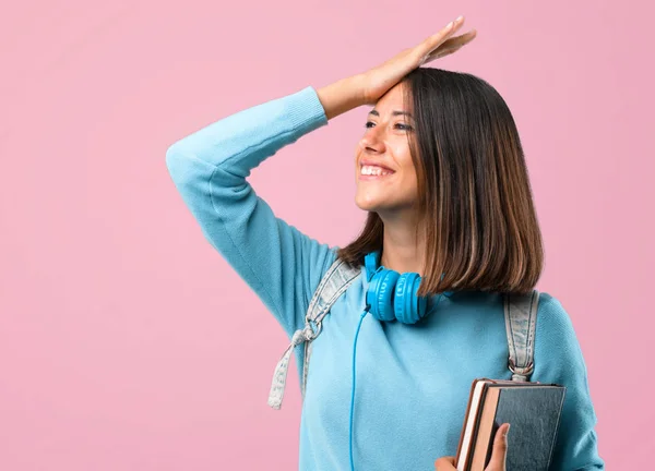 Junges Studentenmädchen Mit Blauem Pullover Und Kopfhörer Hat Gerade Etwas — Stockfoto