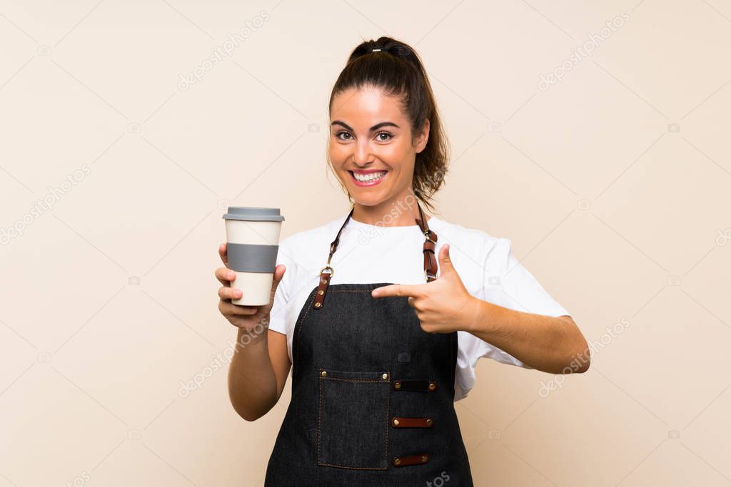 Young employee woman holding a take away coffee with surprise facial expression