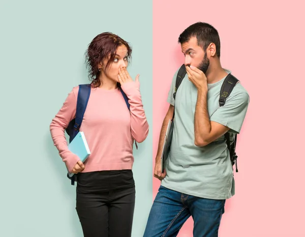 Two Students Backpacks Books Covering Mouth Hands Saying Something Inappropriate — Stock Photo, Image