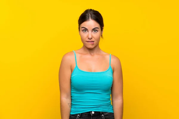 Young Woman Isolated Yellow Background Having Doubts Confuse Face Expression — Stock Photo, Image