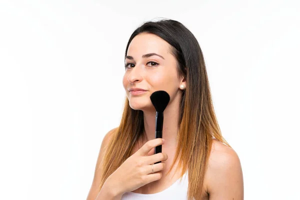 Mujer Joven Sosteniendo Una Gran Cantidad Cepillo Maquillaje Sobre Fondo — Foto de Stock