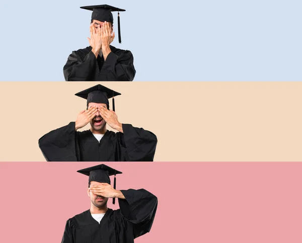 一套人在他的毕业日大学覆盖眼睛用双手在五颜六色的背景 — 图库照片