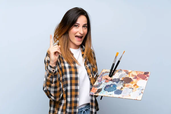 Young Painter Woman Isolated Blue Background Pointing Great Idea — Stock Photo, Image