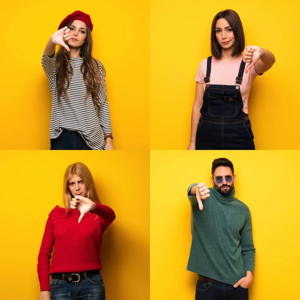 Negatif ifade ile başparmak dowg gösteren kişi kümesi