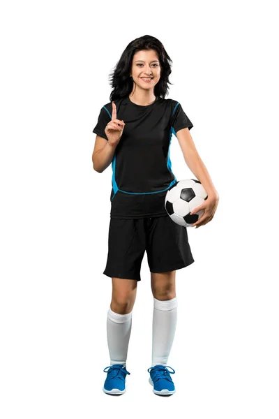 孤立した白い背景の上に素晴らしいアイデアを指し示す若いサッカー選手の女性のフルレングスショット — ストック写真