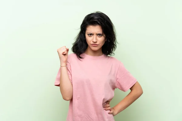 Young Woman Isolated Green Background Angry Gesture — Stock Photo, Image