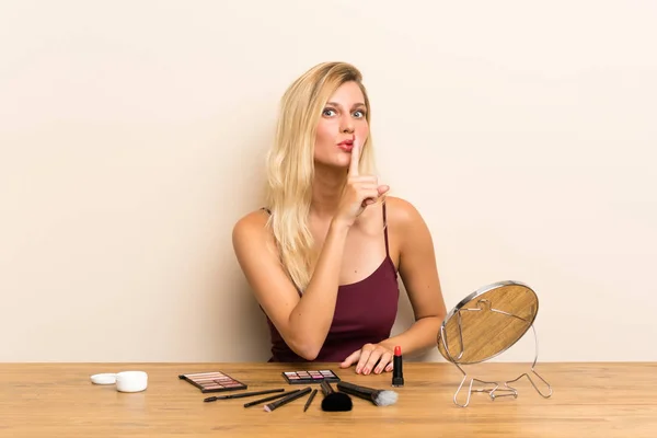 Young Blonde Woman Cosmetic Table Doing Silence Gesture — Stock Photo, Image