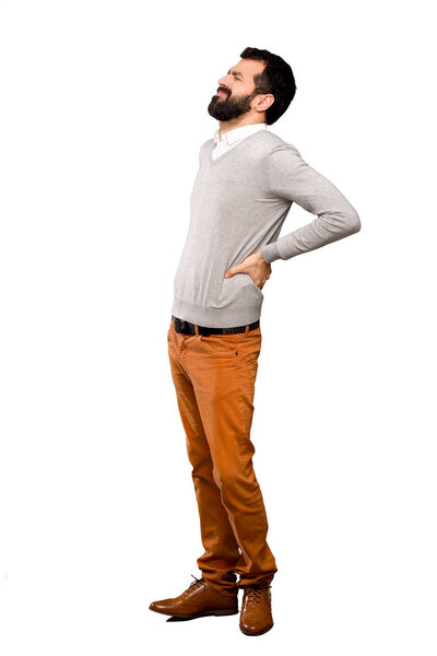 Handsome man suffering from backache for having made an effort over isolated white background