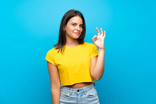 Young Girl Isolated Blue Background Showing Sign Fingers — Stock Photo, Image