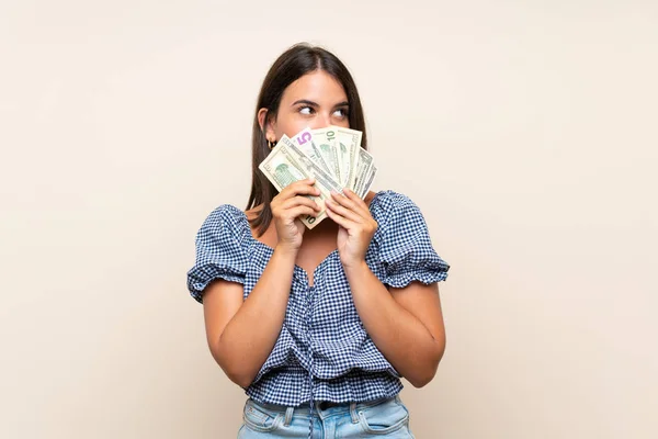 Jovencita Sobre Aislado Fondo Tomando Montón Dinero —  Fotos de Stock