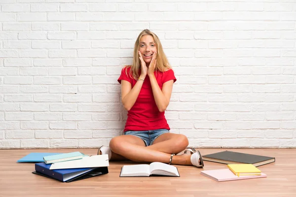 Young Blonde Student Girl Many Books Floor Surprise Facial Expression — Stock Photo, Image