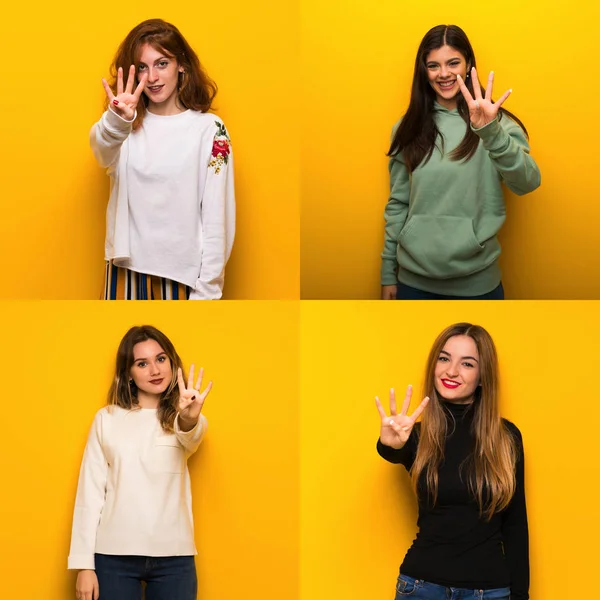 Conjunto Mulheres Sobre Fundo Amarelo Feliz Contando Quatro Com Dedos — Fotografia de Stock