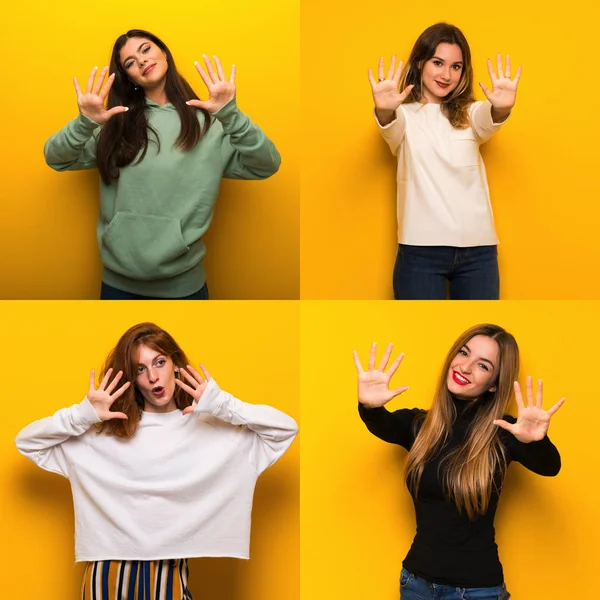 Conjunto Mujeres Sobre Fondo Amarillo Contando Diez Con Dedos —  Fotos de Stock