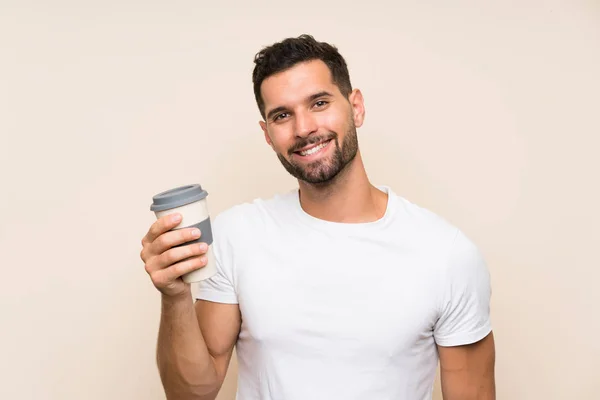 Knappe Man Geïsoleerde Achtergrond Houden Van Een Take Away Koffie — Stockfoto