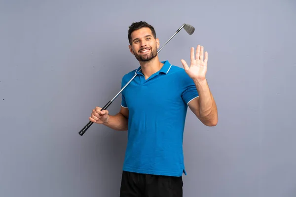 Joven Guapo Jugando Golf Saludando Con Mano Con Expresión Feliz —  Fotos de Stock