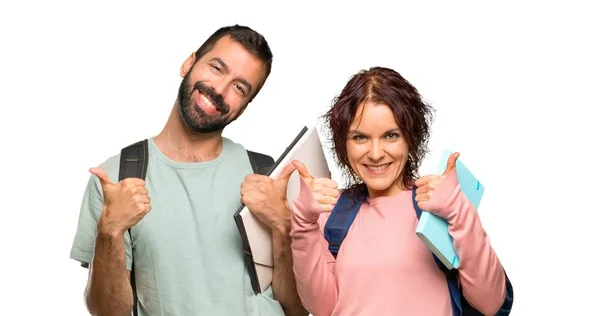 Two Students Backpacks Books Giving Thumbs Gesture Smiling Because Has — Stock Photo, Image