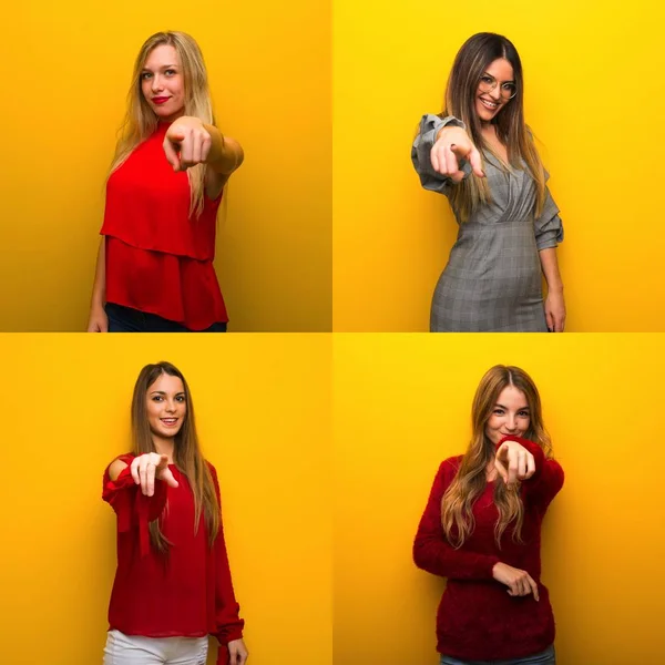 Set of young women points finger at you with a confident expression