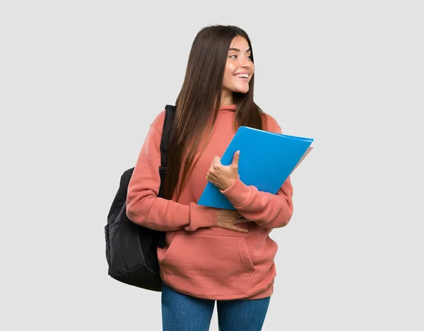 Jovem Estudante Mulher Segurando Cadernos Feliz Sorrindo Sobre Fundo Cinza — Fotografia de Stock