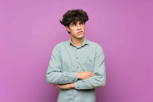 Young Man Isolated Purple Wall Confuse Face Expression — Stockfoto