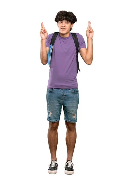 孤立した白い背景の上に最高を望む指を持つ若い学生の男のフルレングスショット — ストック写真