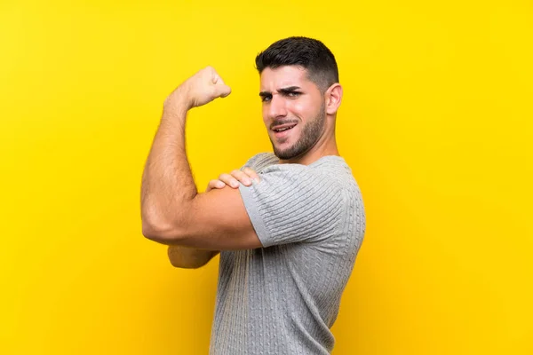 Young Handsome Man Isolated Yellow Background Making Strong Gesture — Stock Photo, Image