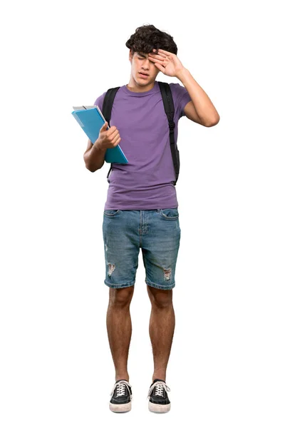 一个年轻学生男子在孤立的白色背景上带着疲惫和病态的表情的全长镜头 — 图库照片