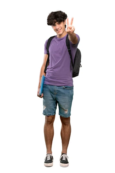 孤立した白い背景の上に笑顔と勝利の兆候を示す若い学生の男のフルレングスショット — ストック写真