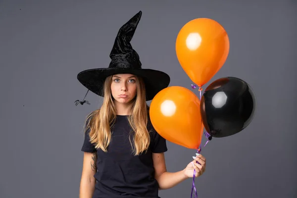 Young Witch Holding Black Orange Air Balloons Sad — Stock Fotó