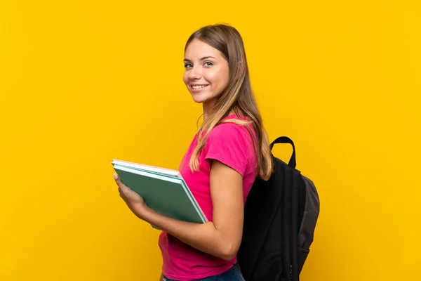 Young Student Girl Isolated Yellow Background Smiling Lot — Stock Photo, Image