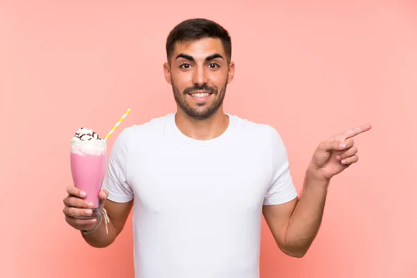 Young Man Strawberry Milkshake Isolated Pink Background Surprised Pointing Finger — 스톡 사진