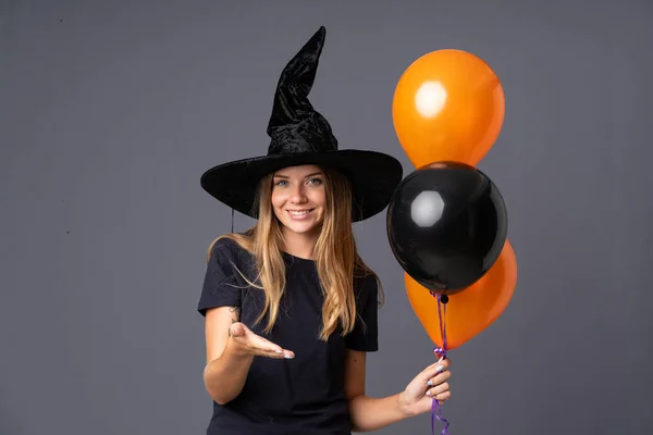 Young Witch Holding Black Orange Air Balloons Handshaking Good Deal — Stock Photo, Image