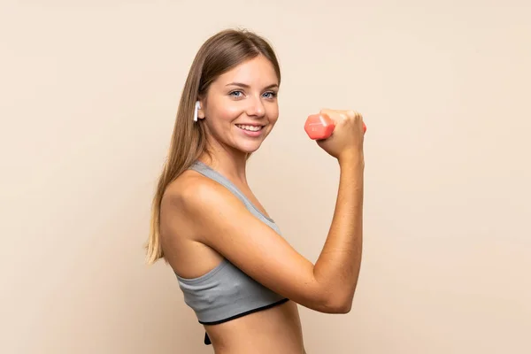 Joven Chica Deportiva Rubia Sobre Fondo Aislado Haciendo Levantamiento Pesas —  Fotos de Stock