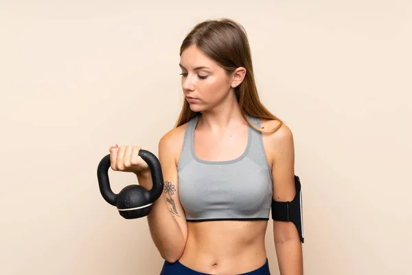 Joven Chica Deportiva Rubia Sobre Fondo Aislado Haciendo Levantamiento Pesas —  Fotos de Stock