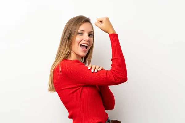 Young Blonde Woman Red Sweater Isolated White Background Making Strong — Stock Photo, Image