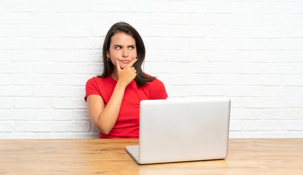 Young Girl Table Thinking Idea Stock Image